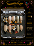 FamiliaRus Nude Black Floral Gold Press-On Nail Set with 3D white flowers and gold heart charms